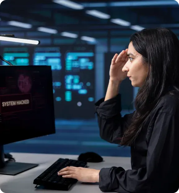 Staff member working with patient records on a computer