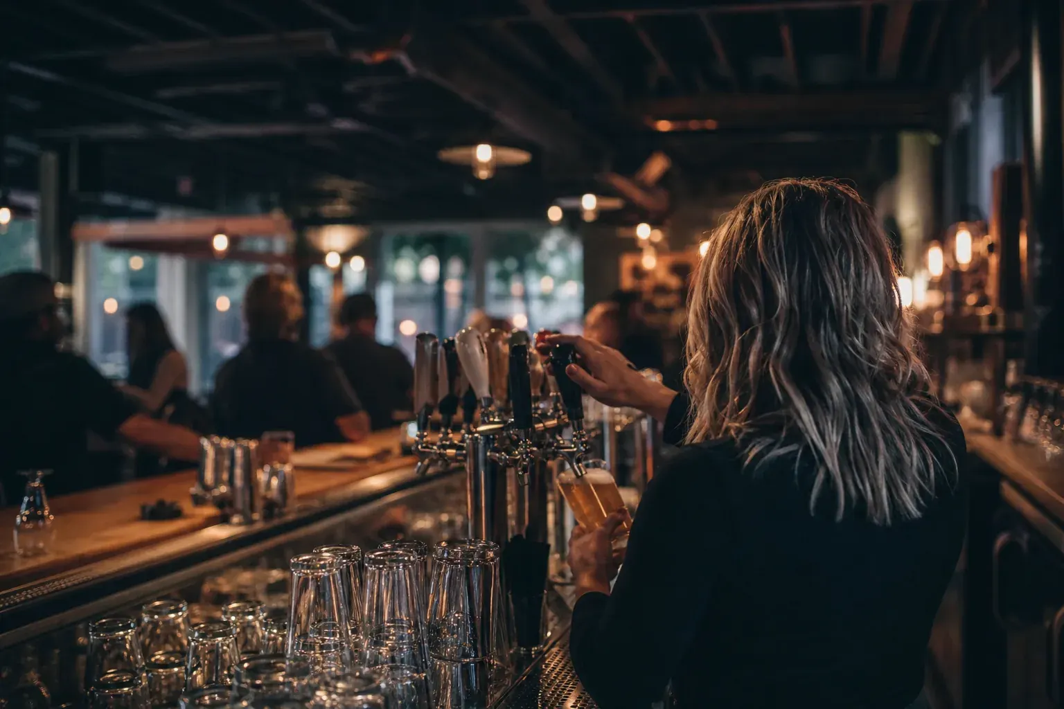 Neighbourhood pub bar with beer taps in the evening