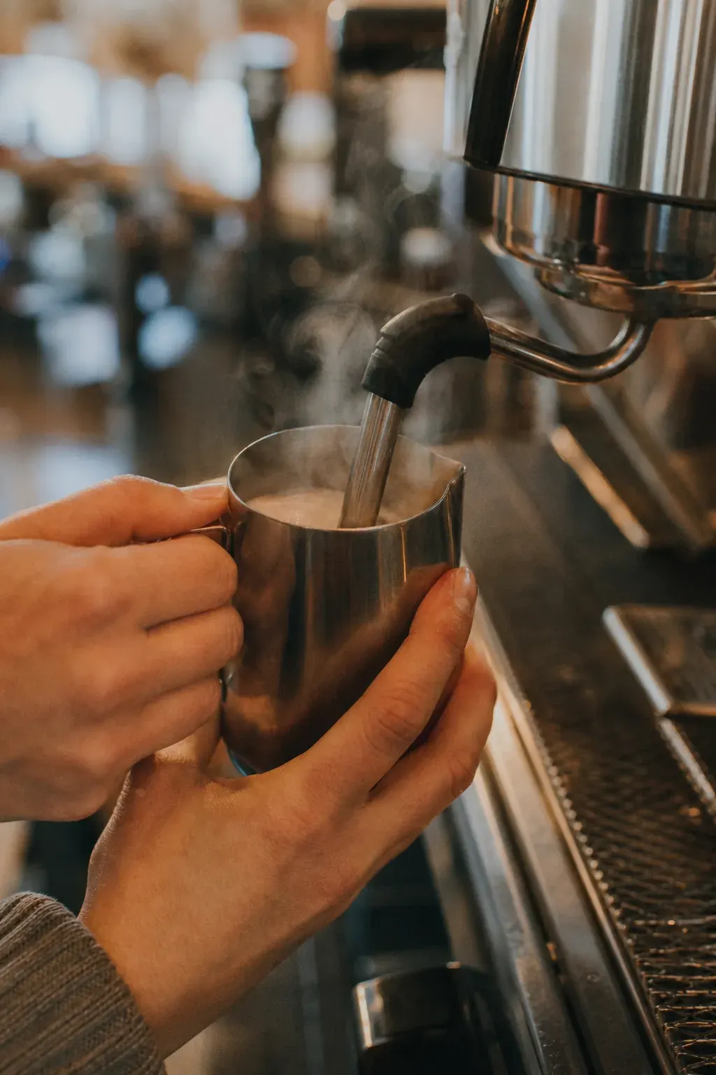 Barista at an espresso machine