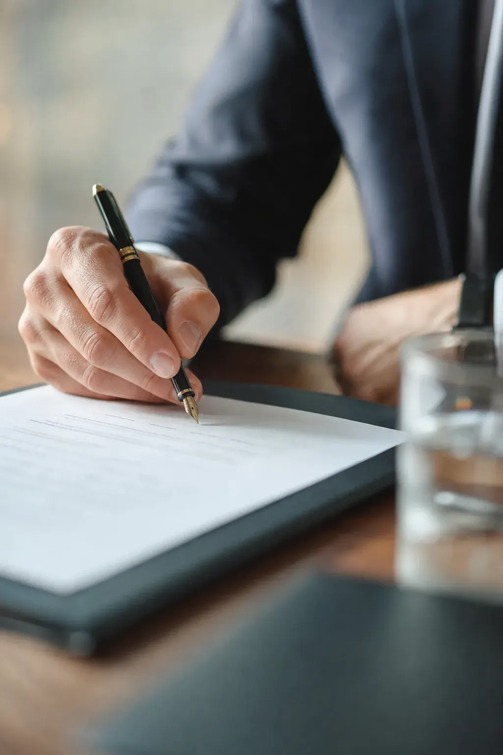 Executive signing a contract