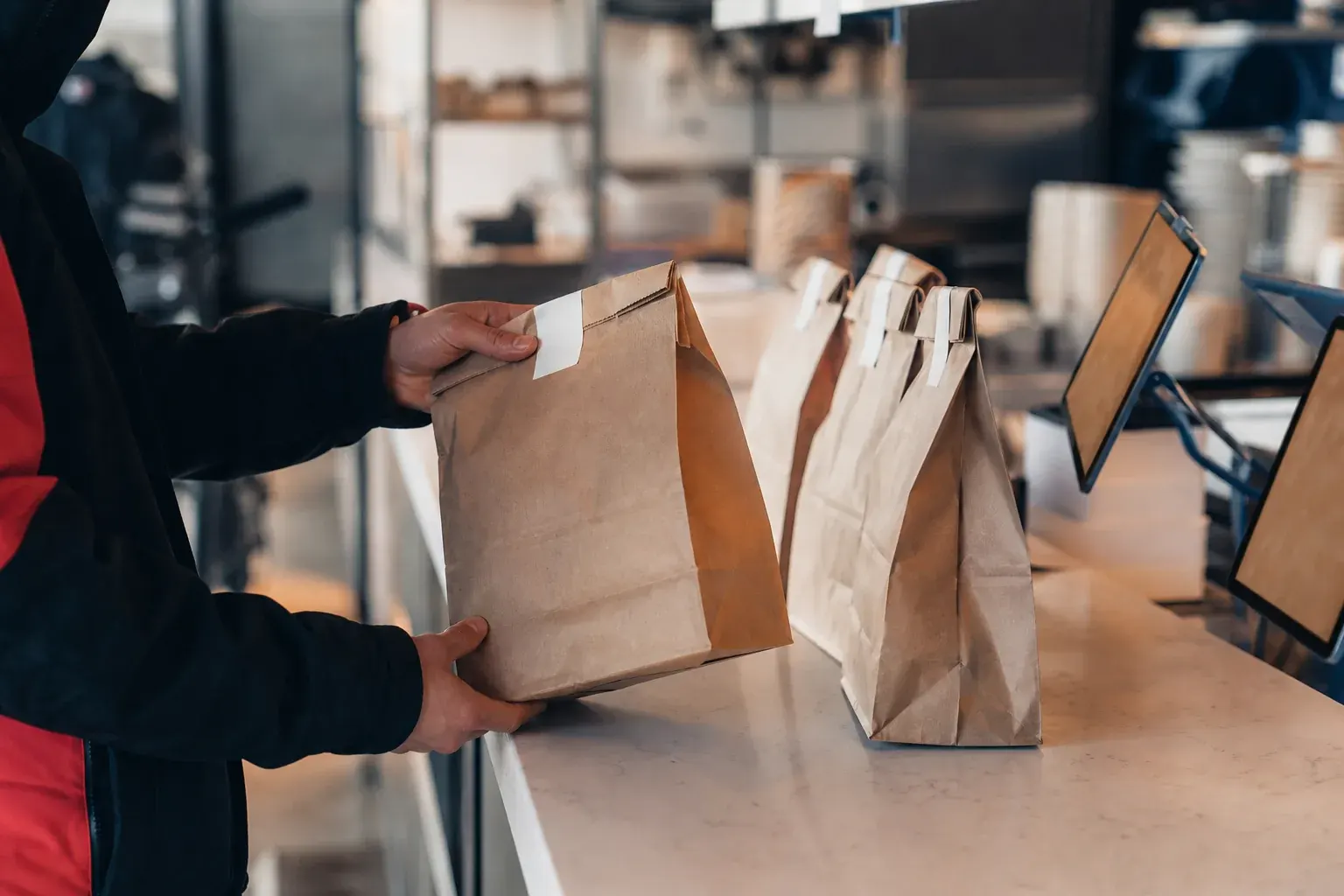 Delivery orders waiting at a takeout pickup counter
