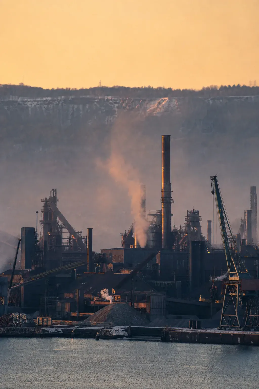 Industrial harbour with steel mills at dusk
