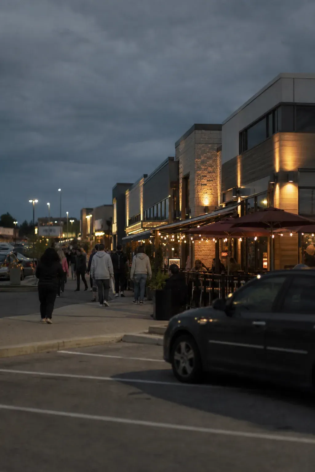 Suburban plaza with restaurants in the evening