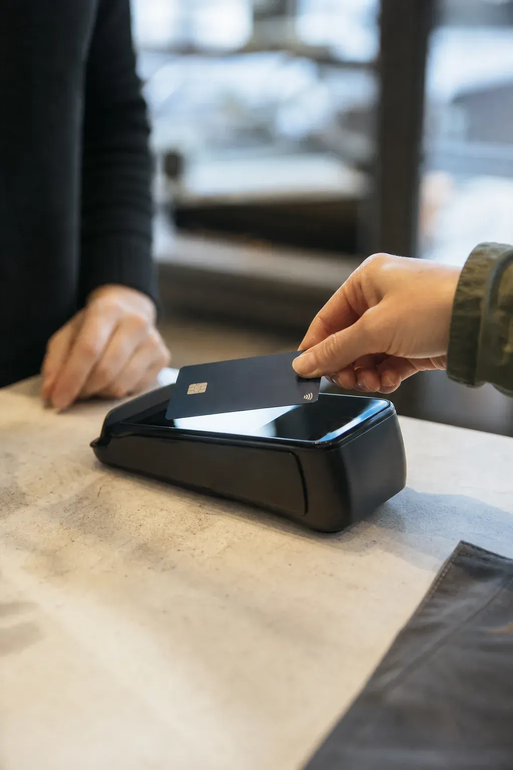 Customer paying by card at a terminal