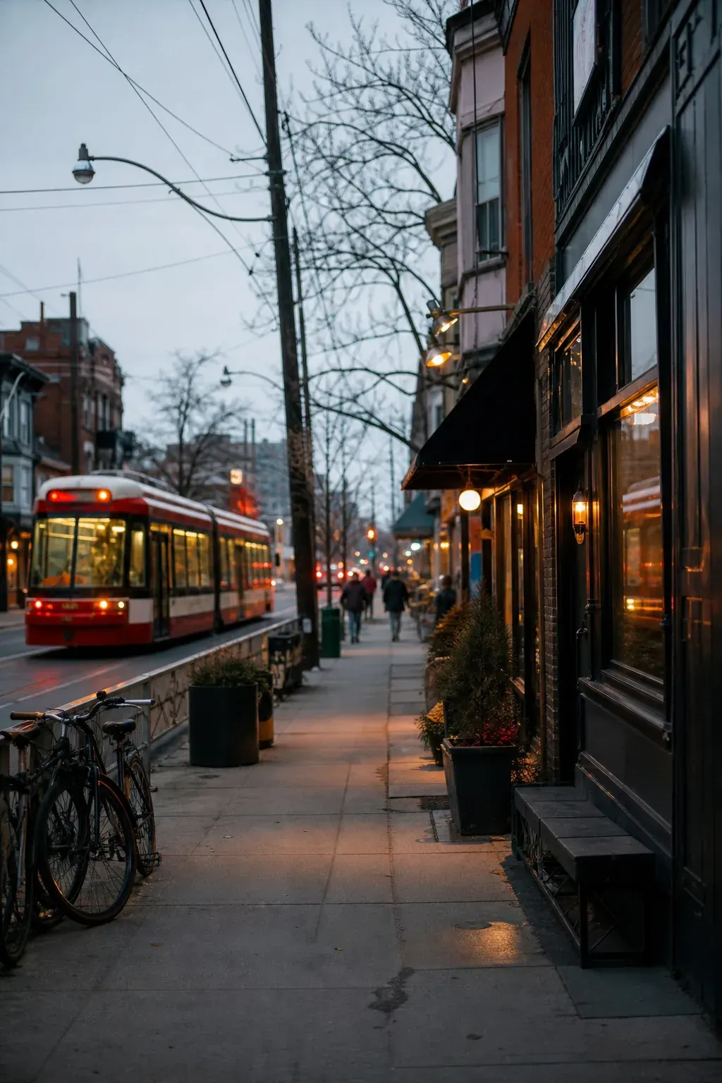 Toronto street with storefronts and a streetcar